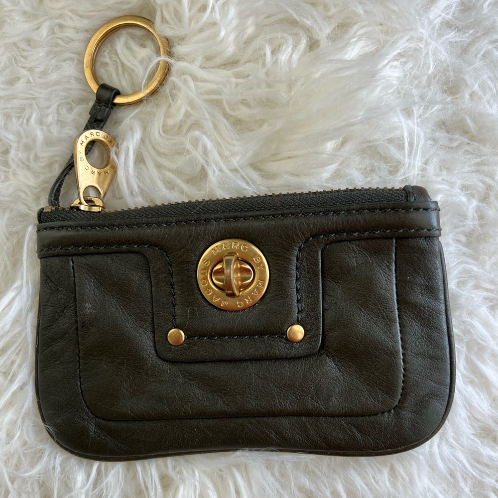 Marc by Marc Jacobs "Totally Turnlock" key pouch featuring gold-tone hardware.